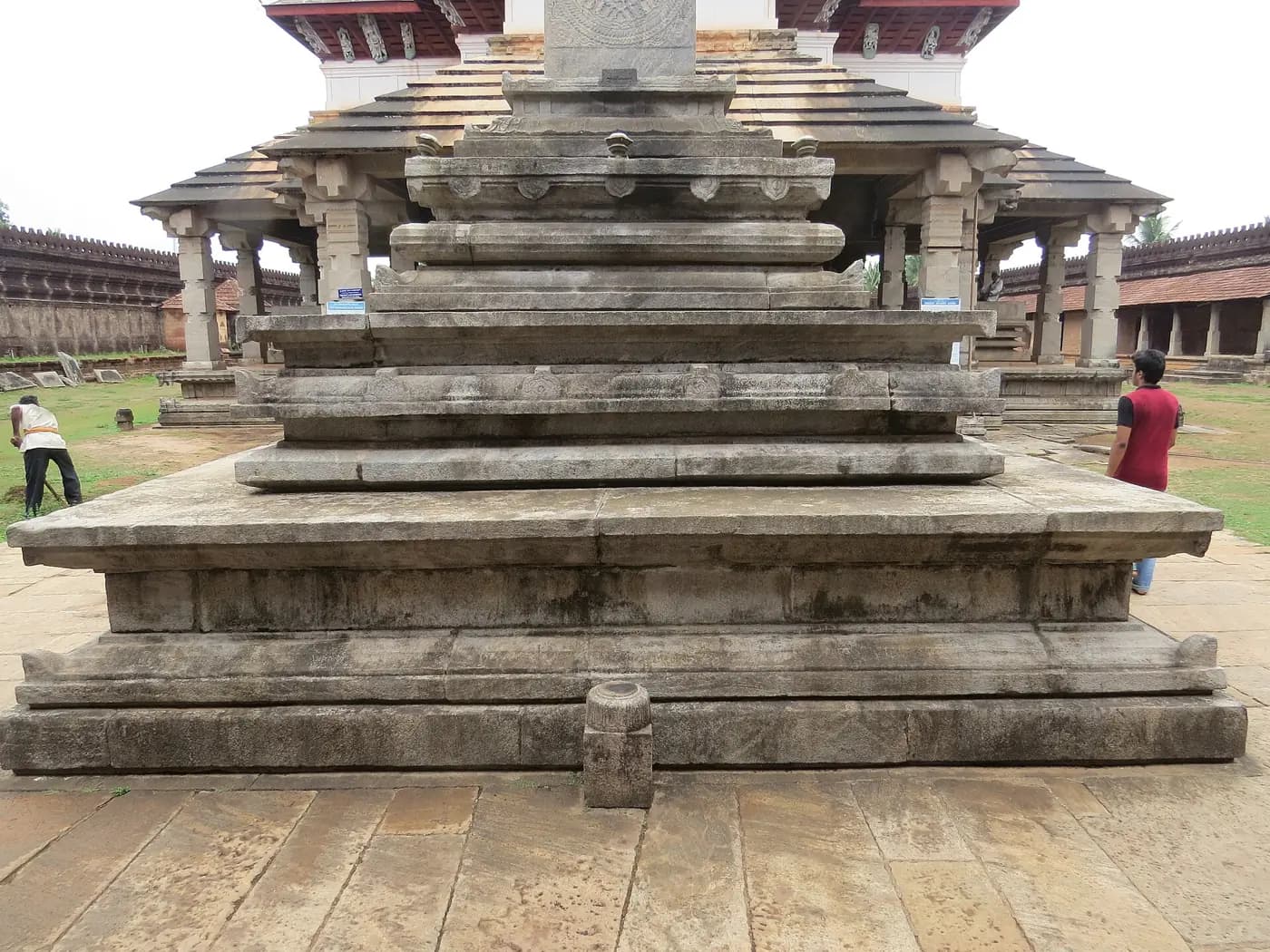 The stone pillar and terraced plinth of the Saavira Kambada Basadi at Moodbidri