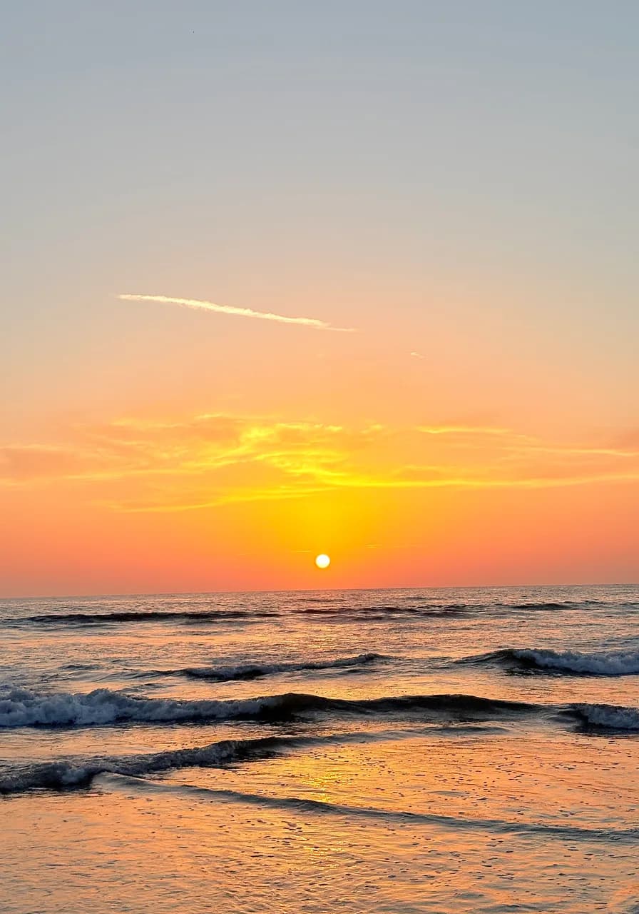 The sun going down into the Arabian Sea at Sasihithlu beach, twenty minutes south of the house