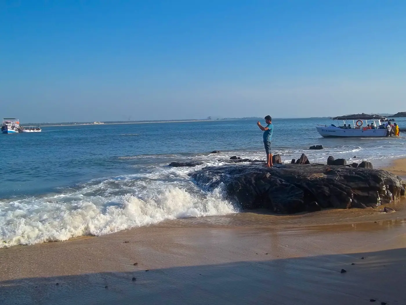 Surf breaking on the basalt rocks of St Mary’s Island off Malpe, a short boat ride from SeaSwara