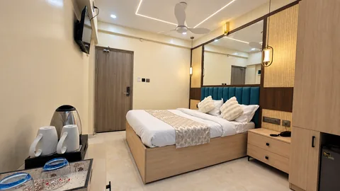 Garden-facing Coastal Comfort Room at SeaSwara — Double bed, Woven wood details, Tea tray