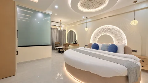 Luna Moon Suite at SeaSwara — Curved bed, Moonlit headboard, Tea corner